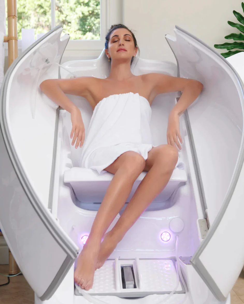 a woman enjoying the benefits of ozone sauna therapy