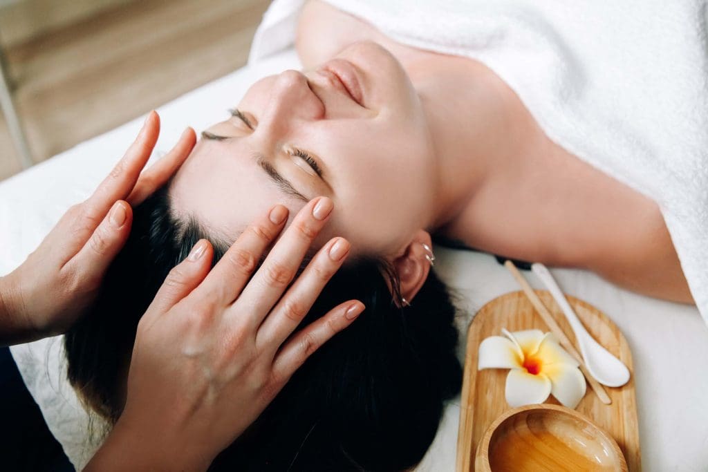 a woman getting a facial massage