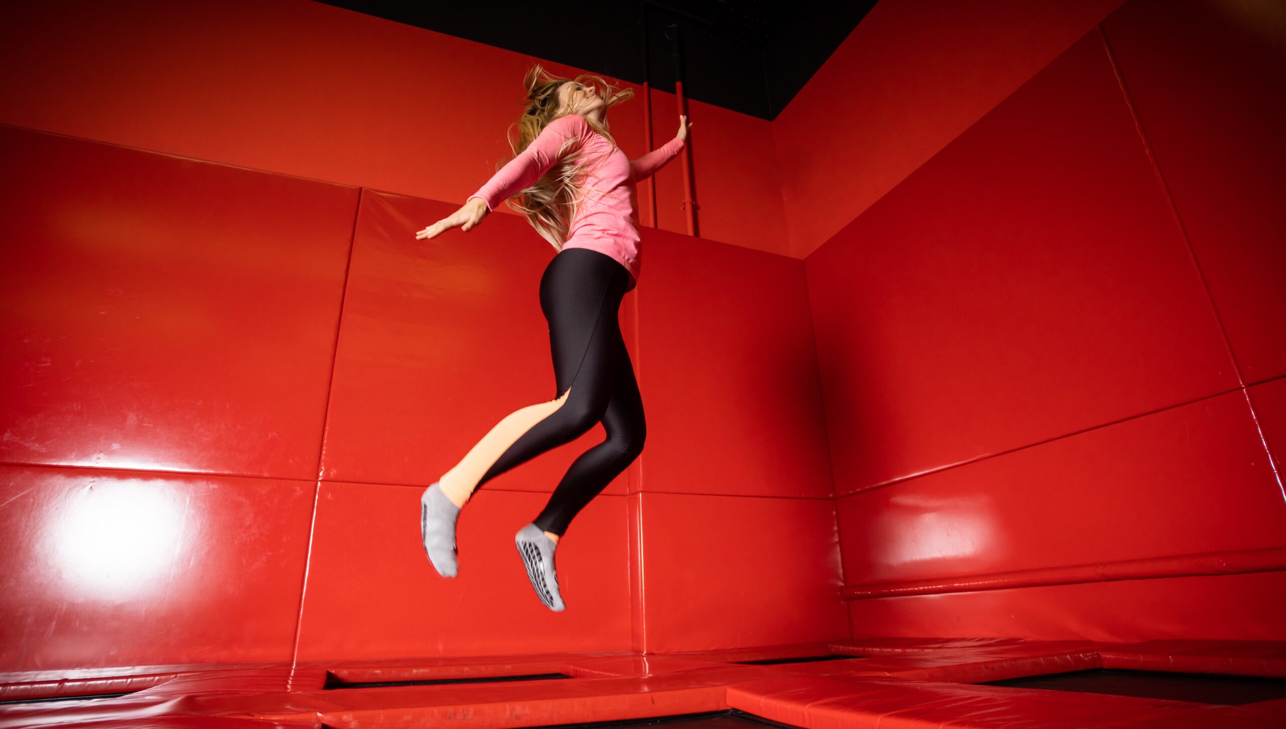 Client combining red light and rebounding in a single wellness session at a spa