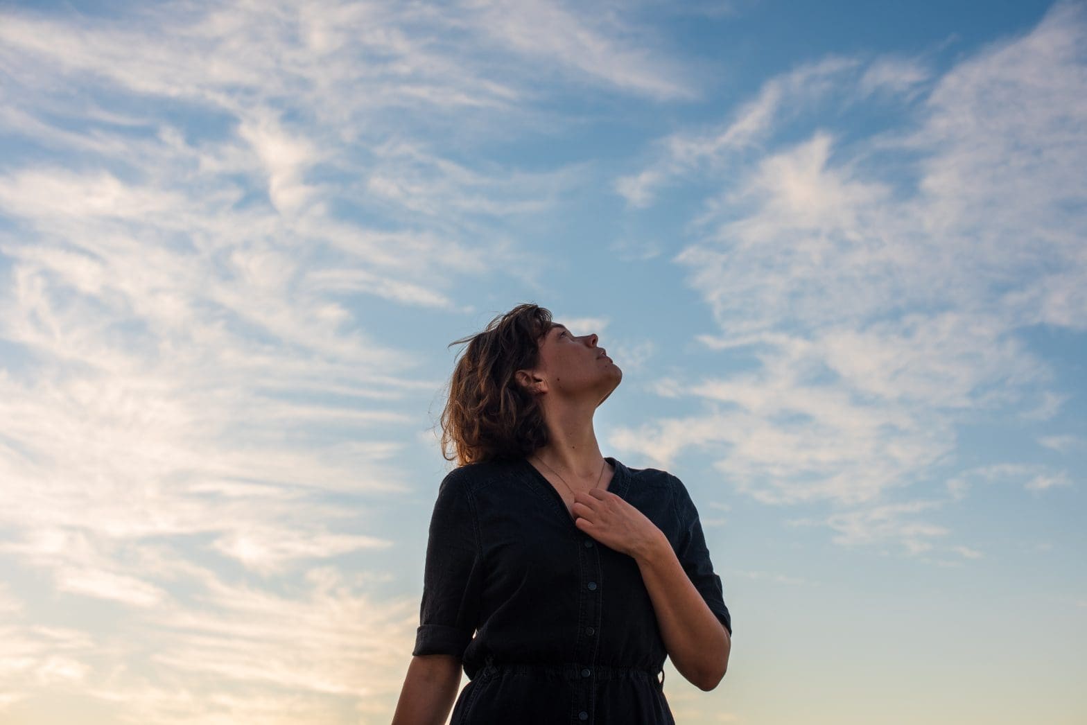 a woman looking up into the sky after she had completed ozone sauna therapy
