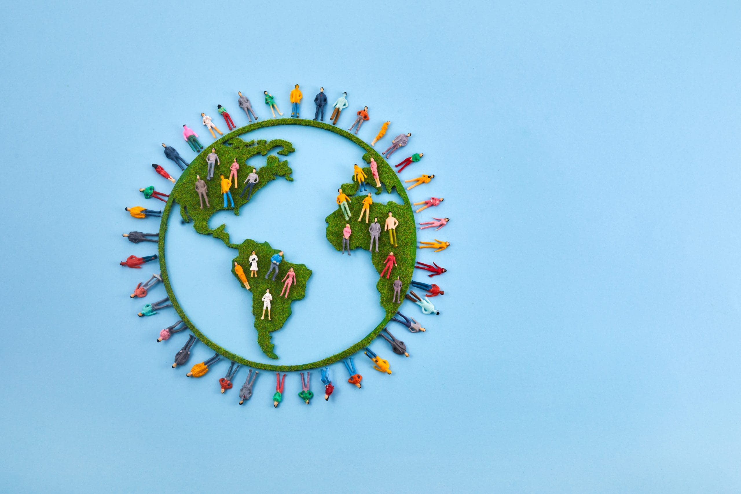 large diverse group of people in the shape of the world map for World Health Day