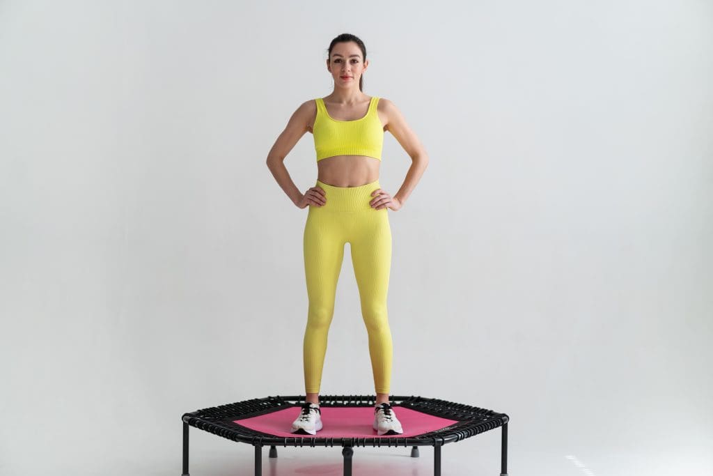 a woman on a mini trampoline showing how rebounder therapy's effect on blood sugar levels is amazing