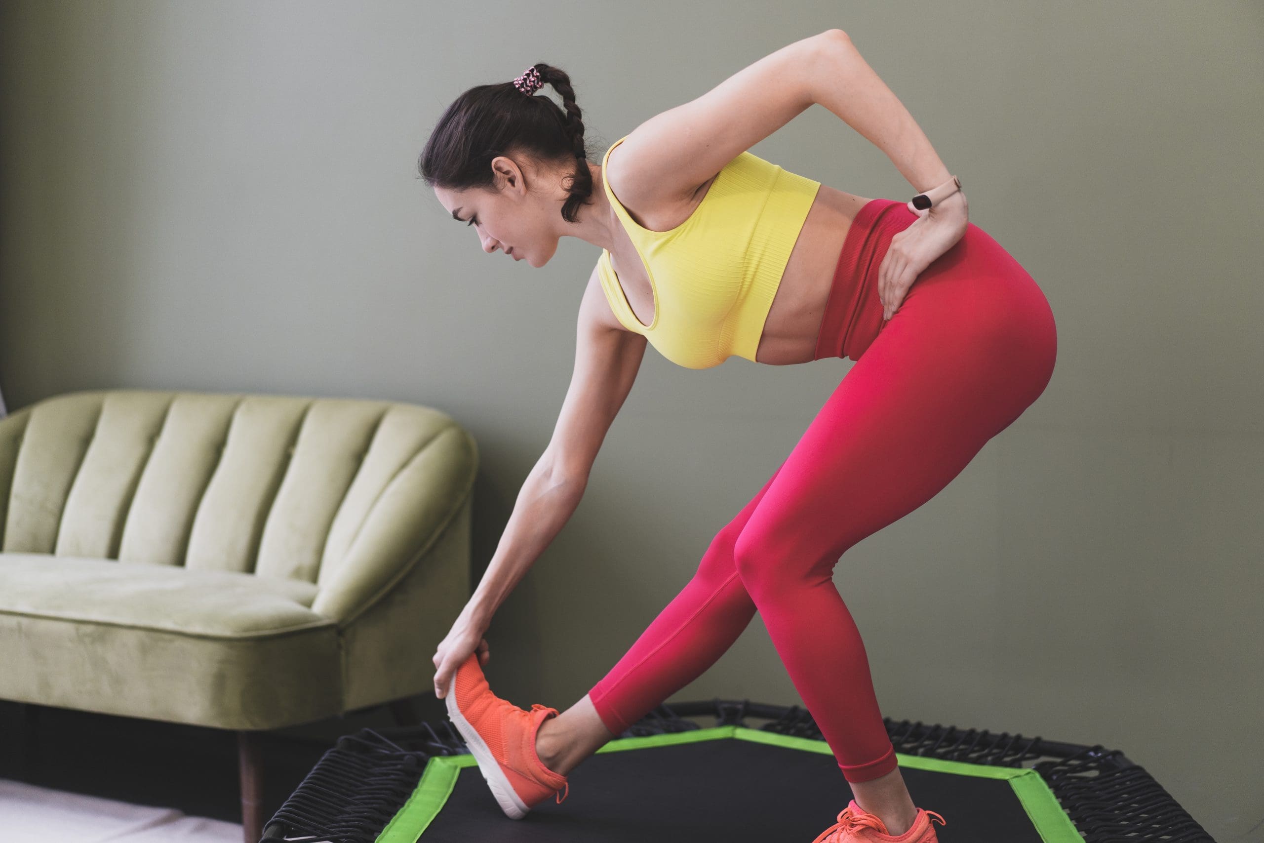 a girl using rebounder therapy to help back pain