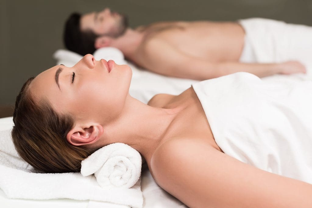 side view of a couple enjoying Holisitc Therapy Day at a spa