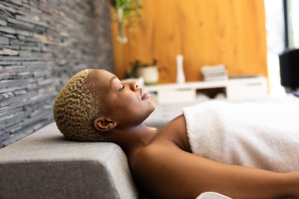 a woman relaxing at a spa during Emotional Awareness Month