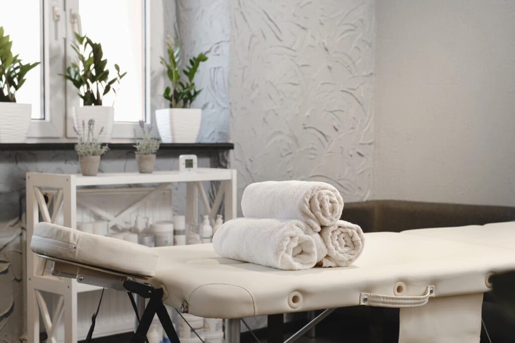 calming massage room setup with natural light and relaxing atmosphere