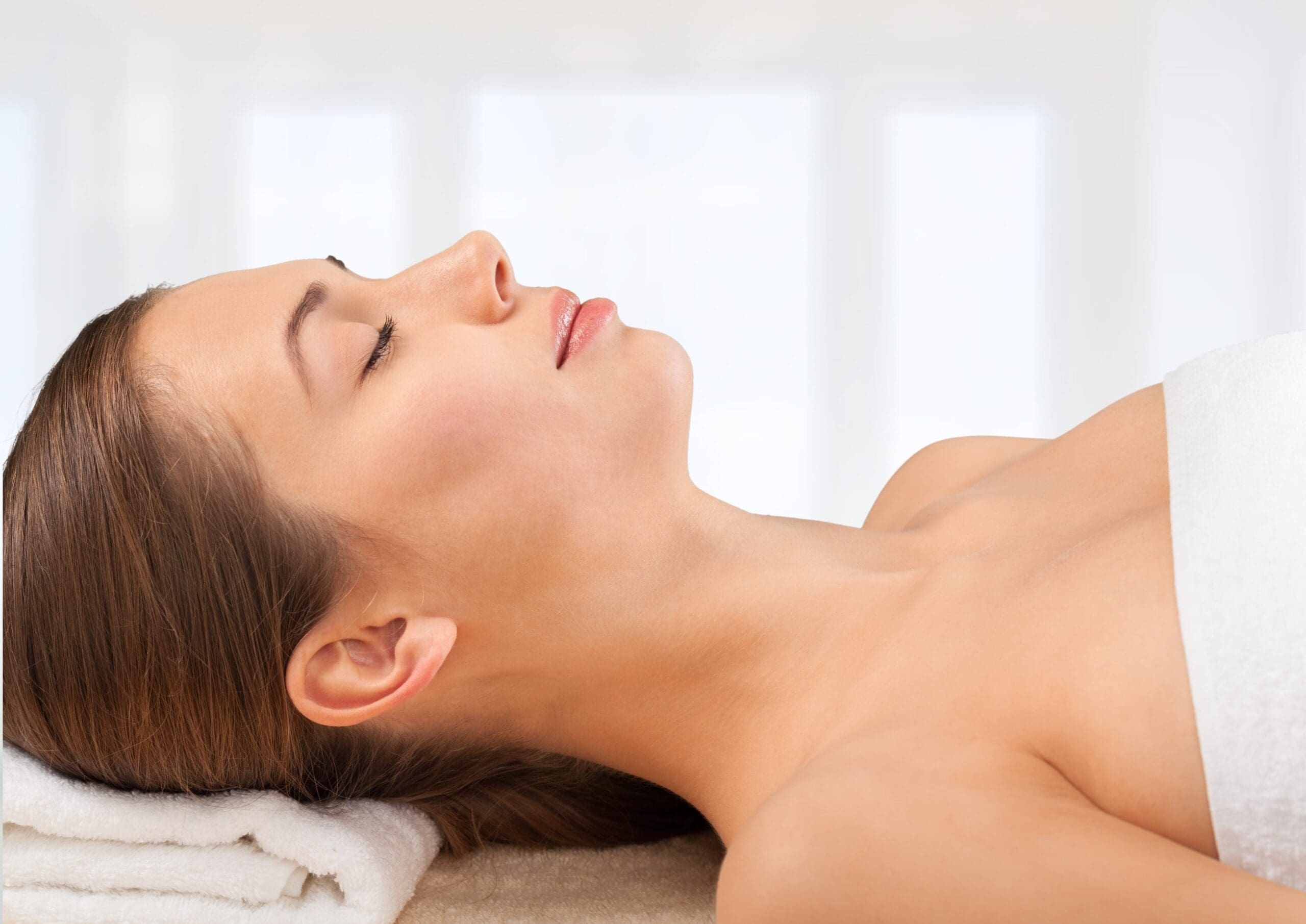 Woman relaxing in spa setting after ozone sauna therapy with cortisol levels balanced