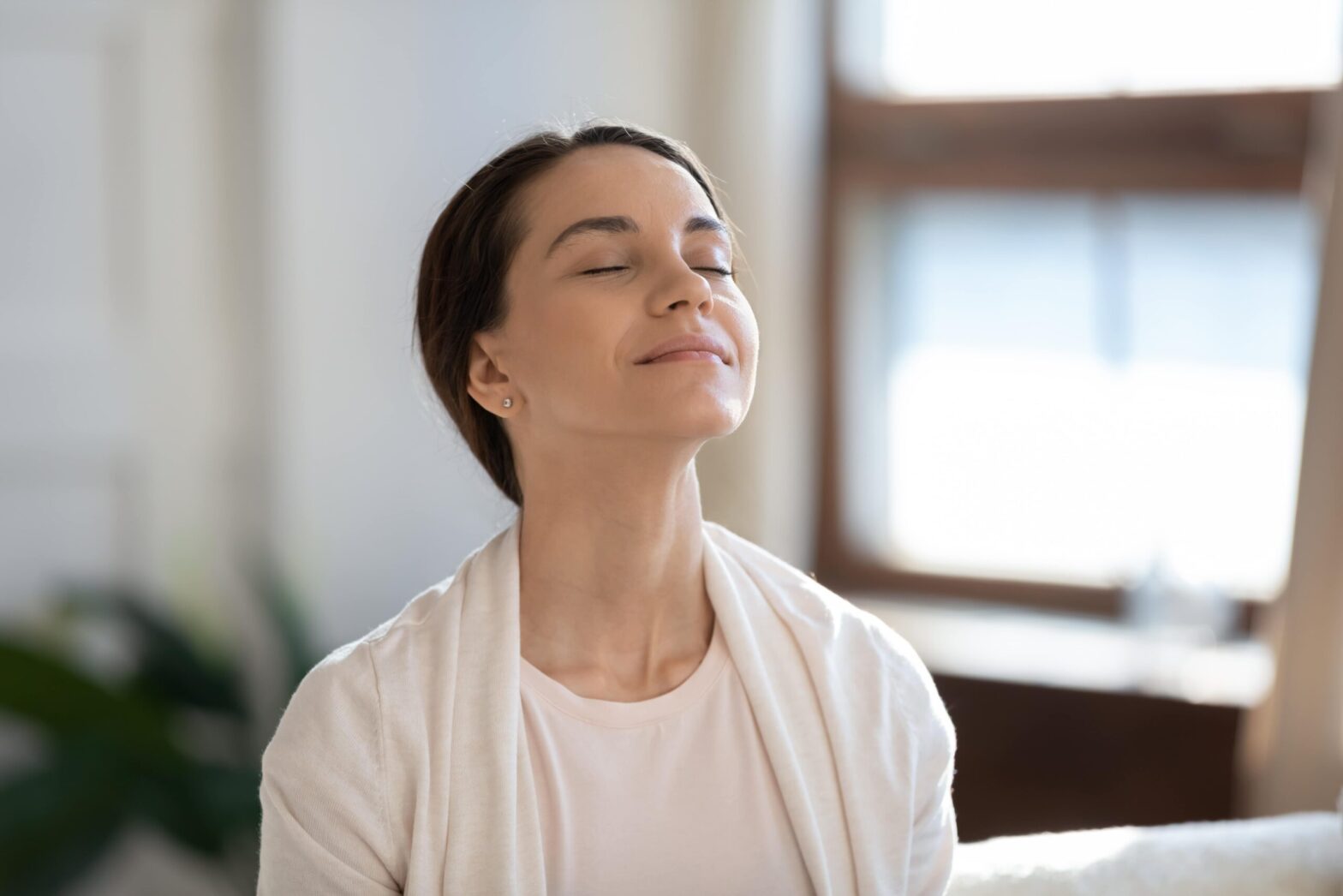 Person starting the day with a 10-minute red light and breathwork routine to clear morning brain fog.