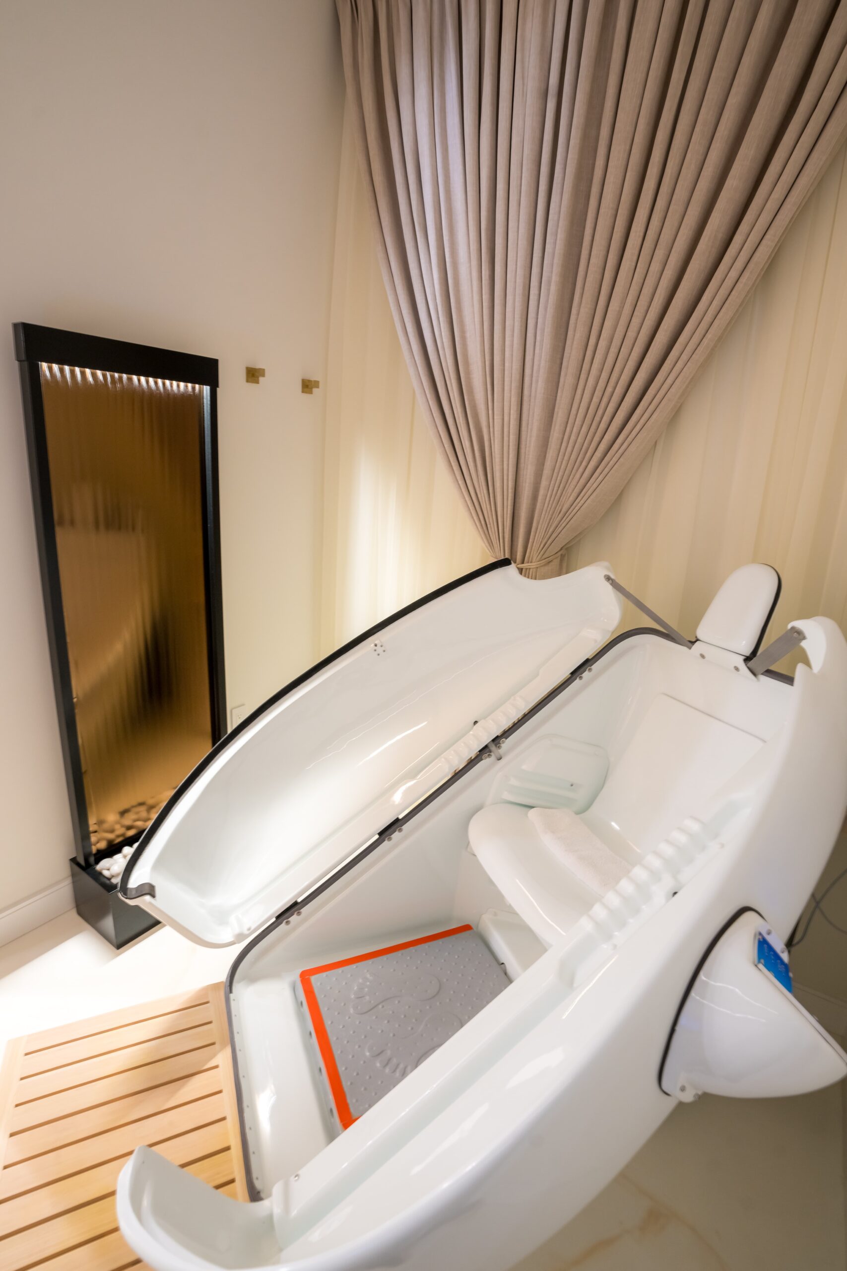 A modern Ozone Sauna cabinet for Systemic Detox at Empower Wellness Spa.